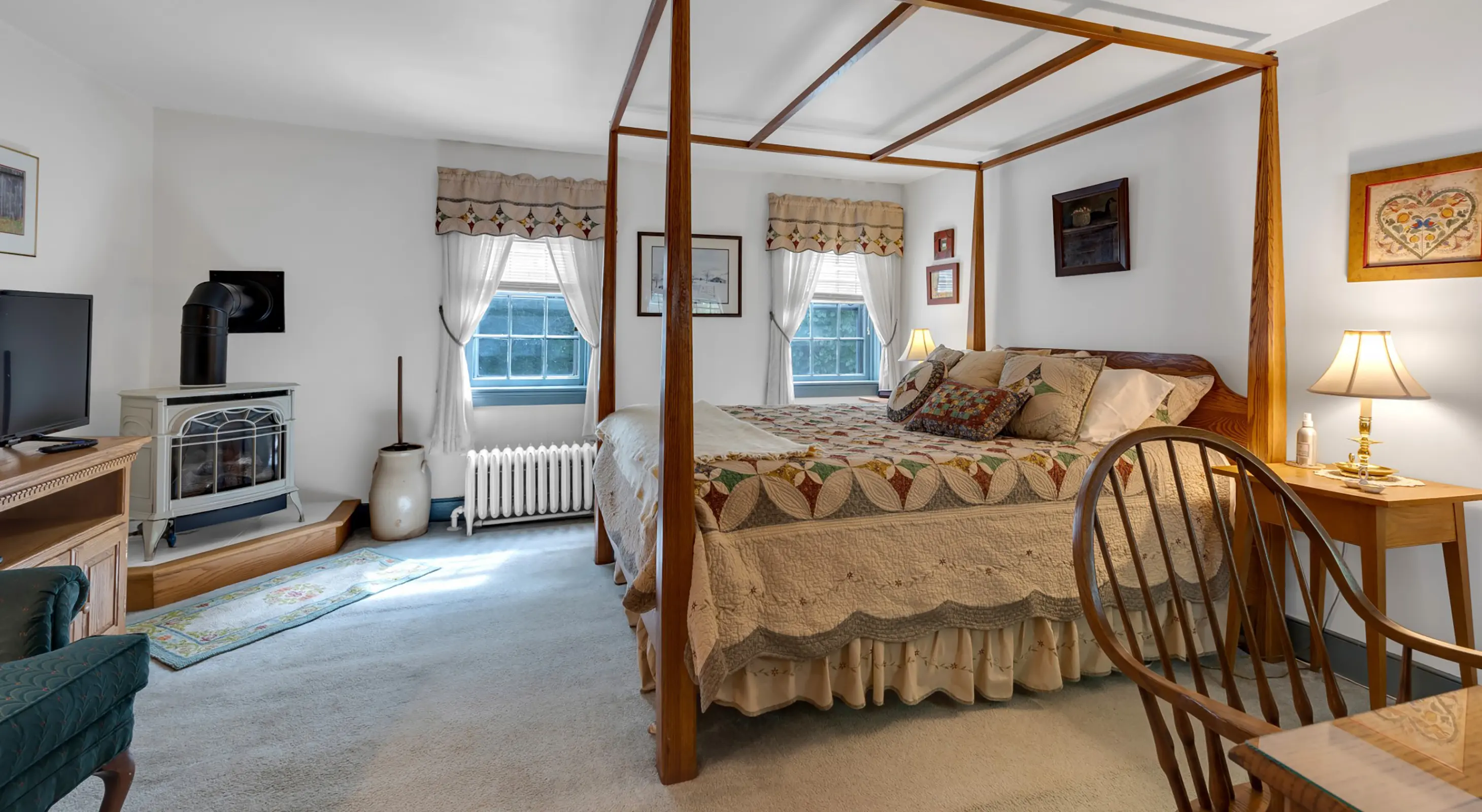 Churchtown room bed and fireplace offering expectational lodging in Amish Country, PA