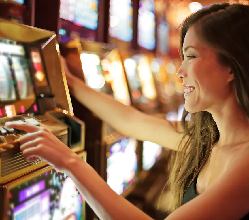 Woman playing slot machine